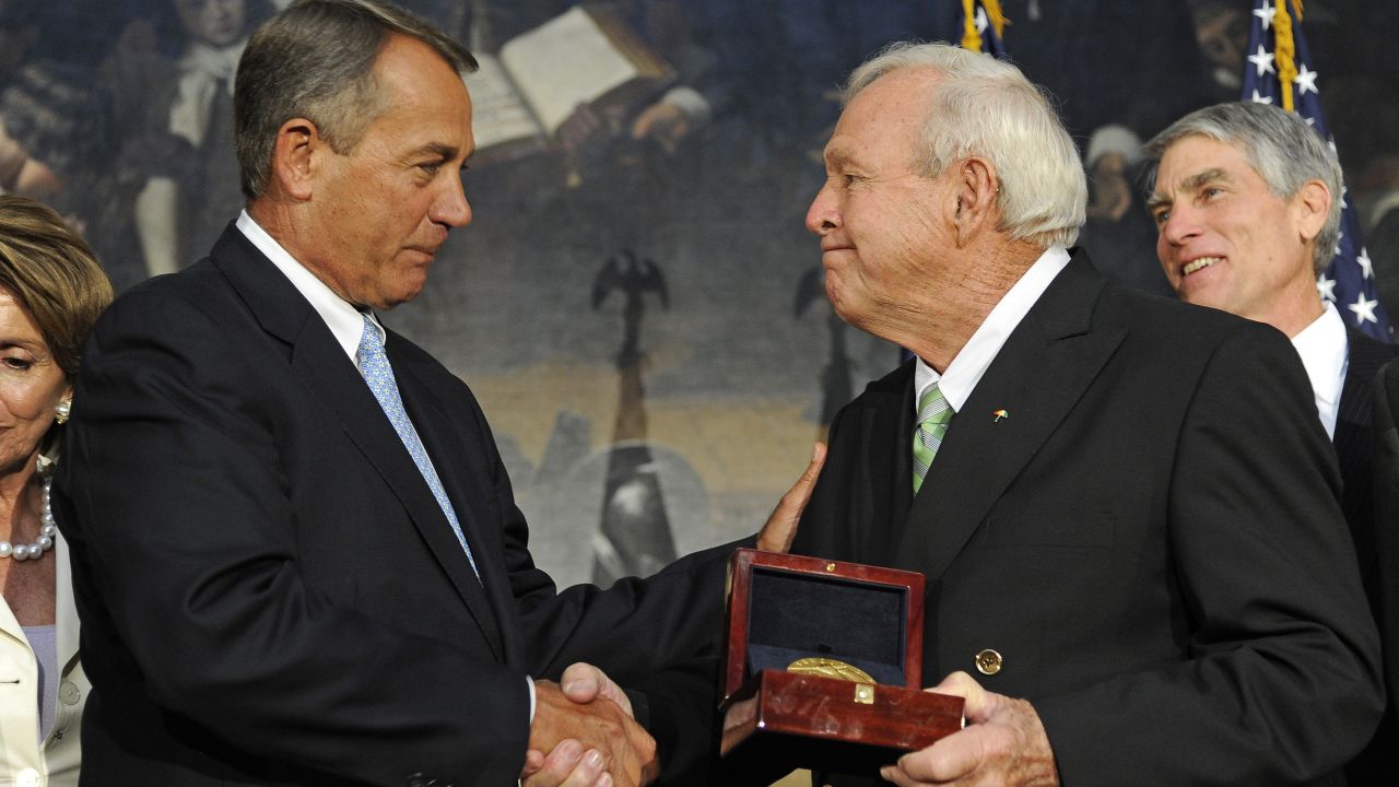 Boehner presents golfing legend Arnold Palmer with the Congressional Gold Medal at a special ceremony in the Rotunda of the Capitol in September 2012.