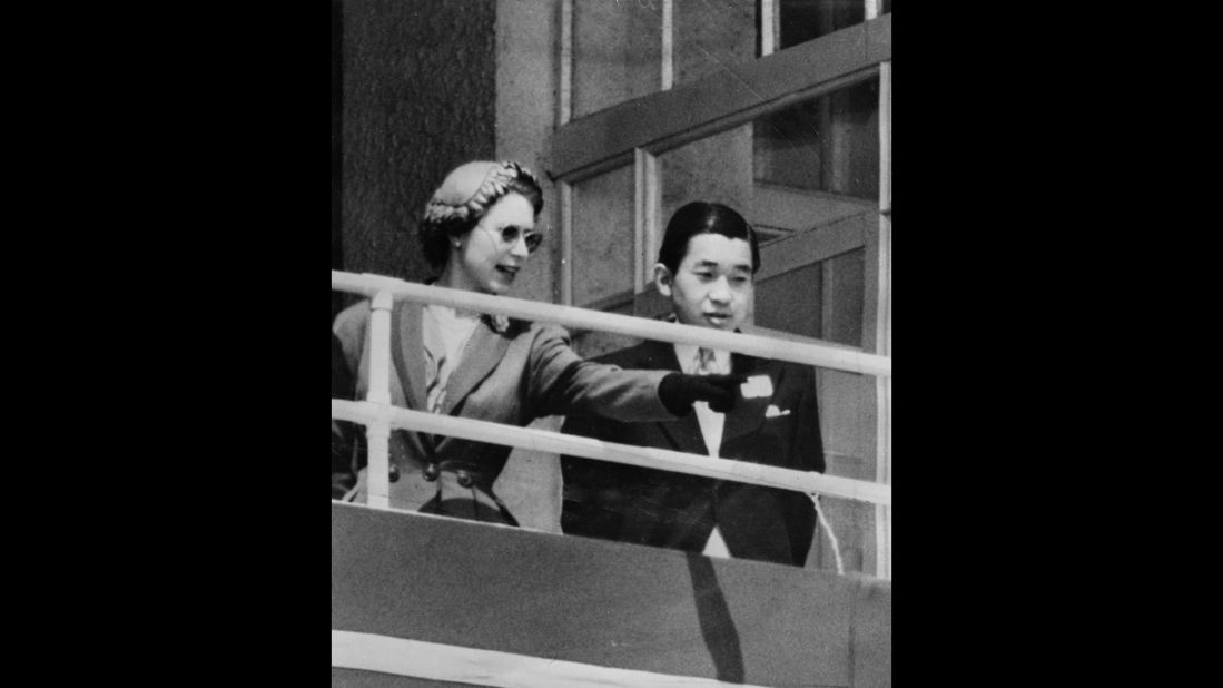 Queen Elizabeth II and Akihito are seen in the royal box at the Epsom Downs Racecourse on June 6, 1953, in England. Crown Prince Akihito made the trip to attend her coronation.