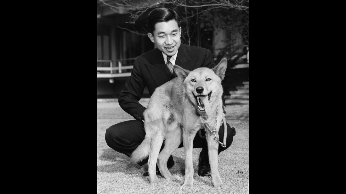 Akihito with his pet dog Dingo in December 1963, on the grounds of Togu Palace, his residence in Tokyo.