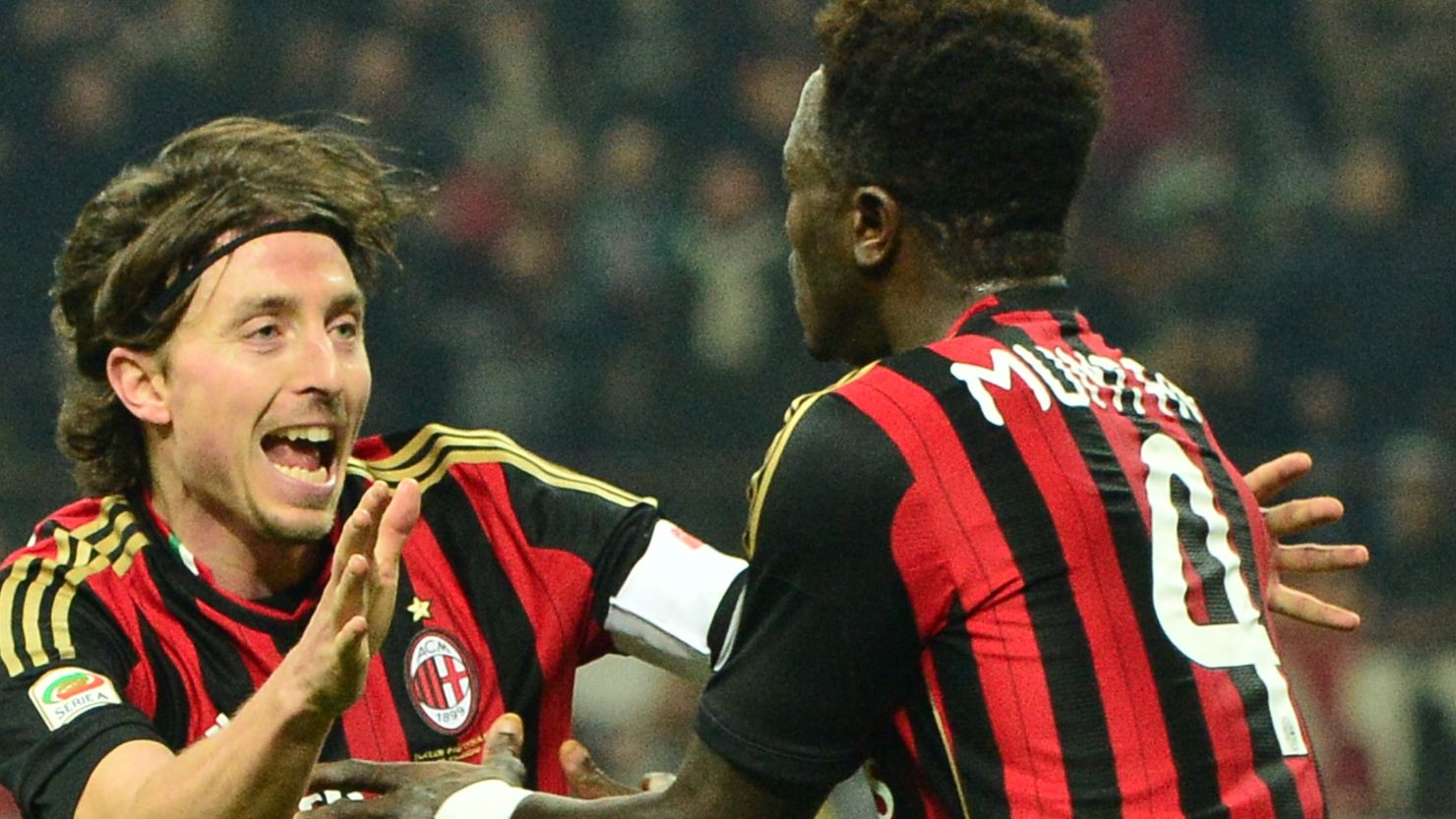 Sulley Muntari celebrates his late equalizer for AC Milan in the San Siro against AS Roma.