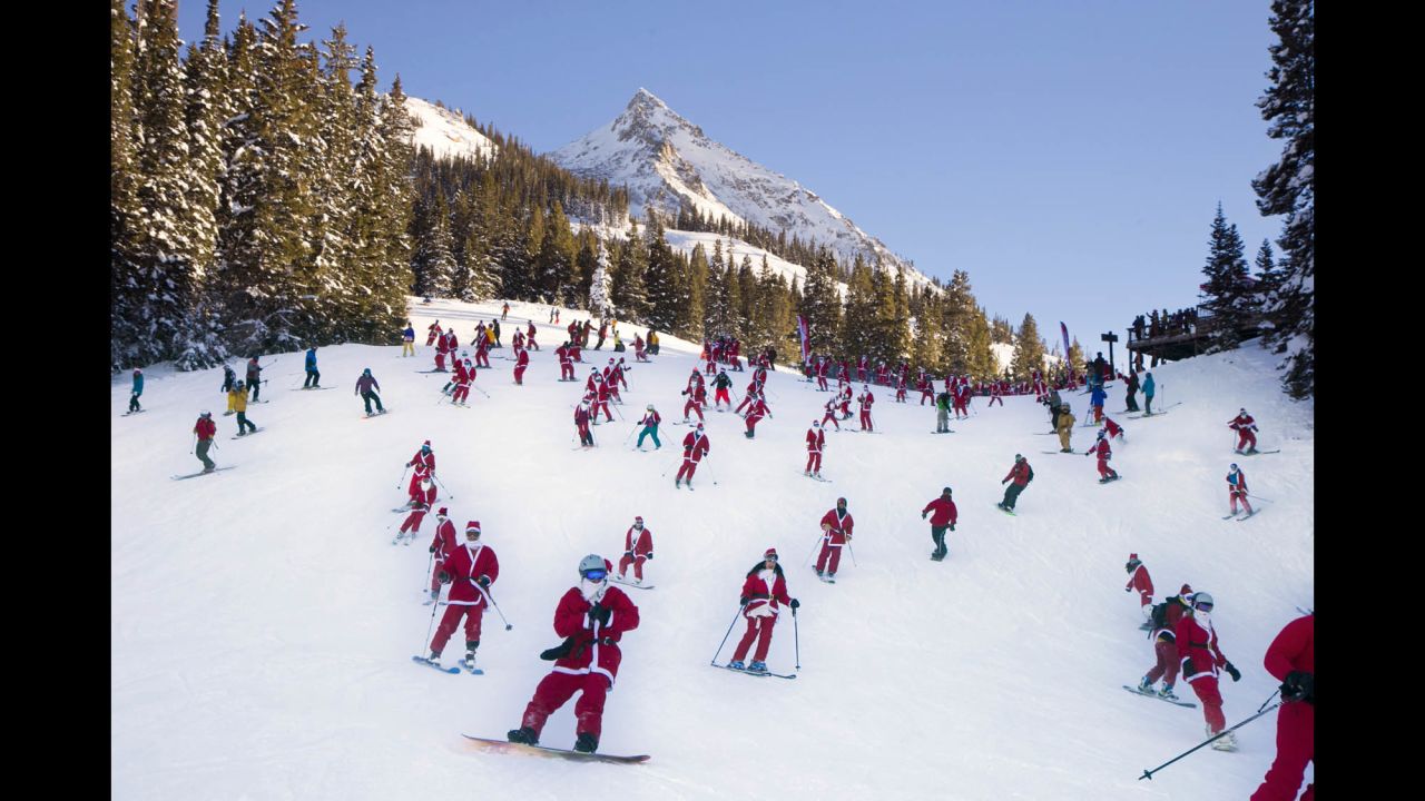 Santas ski from Uley's Ice Bar on Crested Butte Mountain in Crested Butte, Colorado, for the first 'Santa Ski Crawl' on Saturday, December 14.