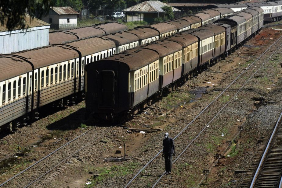 A construction worker walks through the dilapidated rails in Nairobi. Work has just begun on a new standard-gauge line between Nairobi and Mombasa. It's being funded by China, just one of numerous Chinese infrastructure projects in Africa