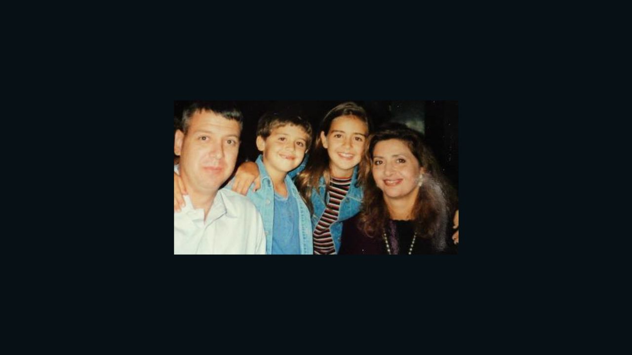 Nicole Eisenschenk, in the striped shirt, is pictured with her family in 1993. They lived in Dallas, Texas.