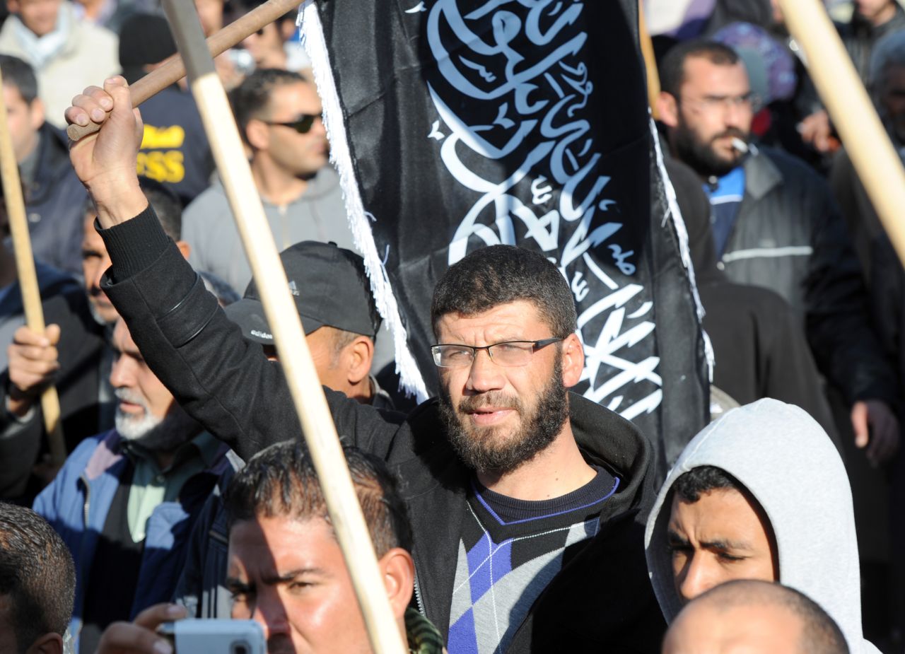Members of Tunisian Islamic group Hizb-ut-Tahrir gather in Mohamed Bouazizi square to mark the third anniversary of the uprising that toppled President Zine el Abidine Ben Ali on December 17, 2013. The square was named after the fruit seller whose self-immolation sparked the revolution that ousted the long-standing ruler and ignited the Arab Spring.