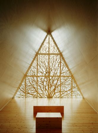 Made almost entirely of wood, the chapel features an intricate carving of a tree, a modern take on the traditional leadlight window. Designed by Vesa Oiva.