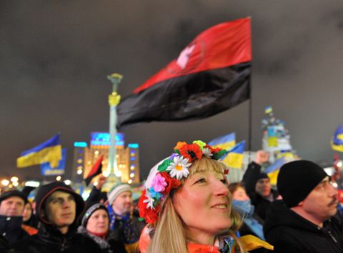 A girl wearing a traditional Ukrainian wreath attends an opposition rally in Independence Square on December 17.