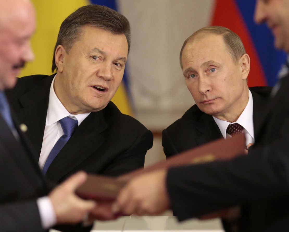 Russian President Vladimir Putin, right, and then-Ukrainian President Viktor Yanukovych in Moscow in 2013.