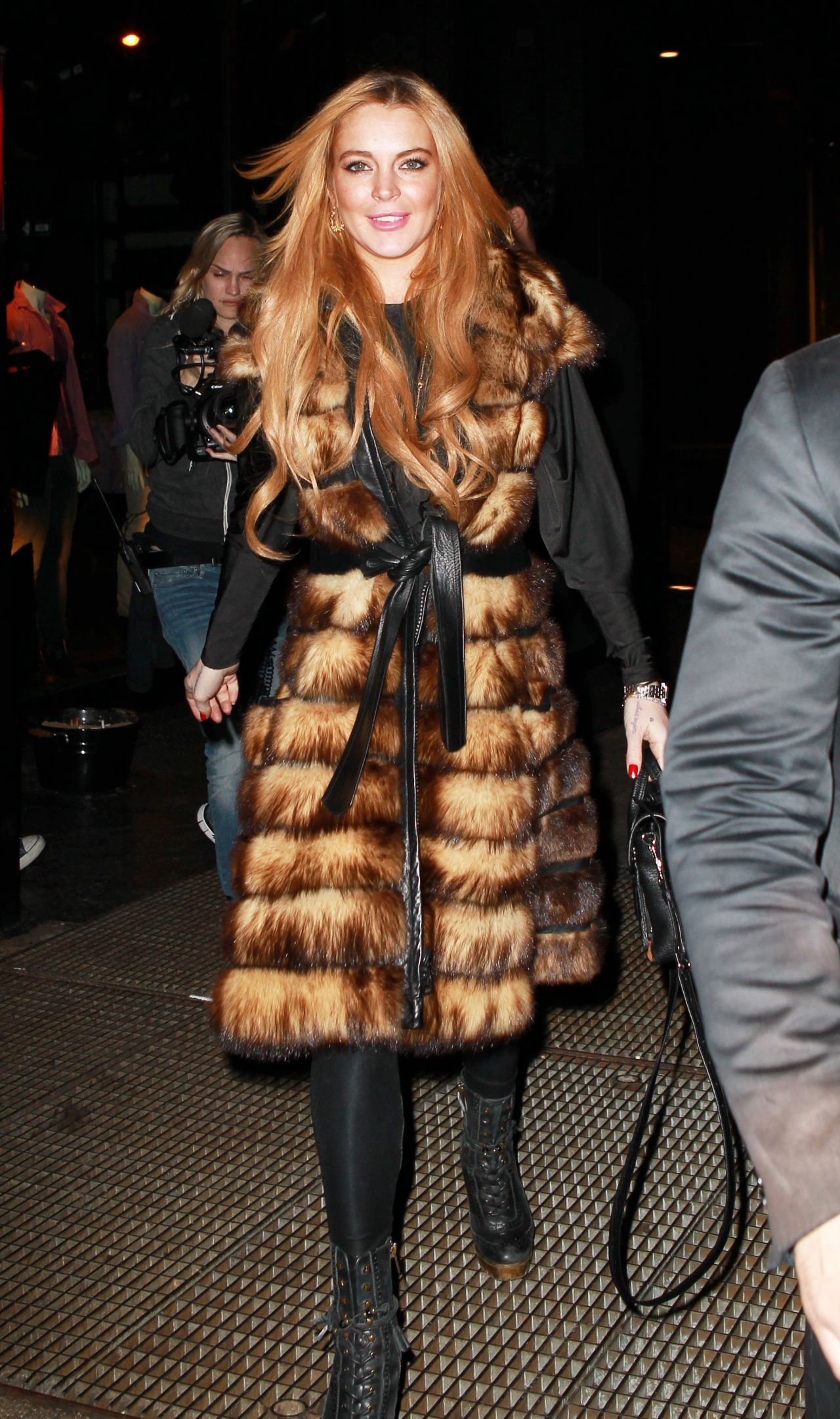 Lindsay Lohan stays warm while in New York on December 16.