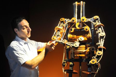 Massimo Ingrosso inspects the complete mechanism of a robot at a 2009 Leonardo da Vinci exhibition at which the famed inventor's creations, including a 1495 "automaton," were brought to life.
