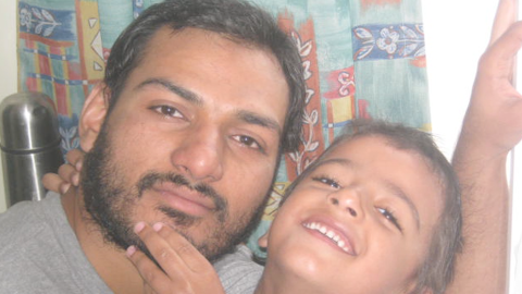 Abbas Khan, pictured with his son Abdullah, had volunteered to treat wounded victims.