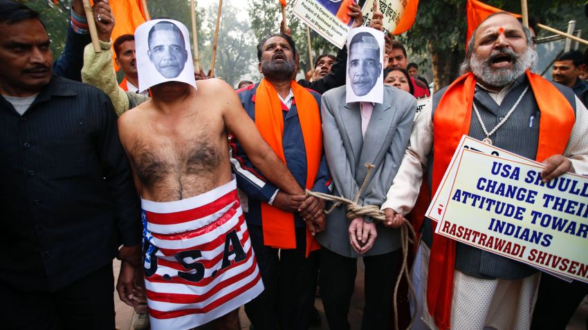 Supporters of right wing Rashtrawadi Shivsena, or nationalist soldiers of Shiva, walk with people representing U.S. President Barack Obama near the U.S Embassy to protest against the alleged mistreatment of New York based Indian diplomat Devyani Khobragade, in New Delhi, India, Wednesday, Dec. 18, 2013.