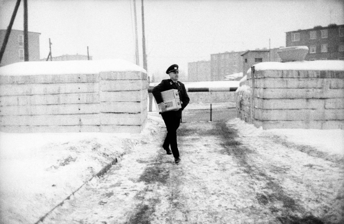 A Western zone officer, in front of the border crossing at Chausseestrasse, carries a box with the first passes. To be granted a pass, only those with close relatives in East Berlin, such as parents, children, siblings, grandparents, aunts and uncles, were eligible.