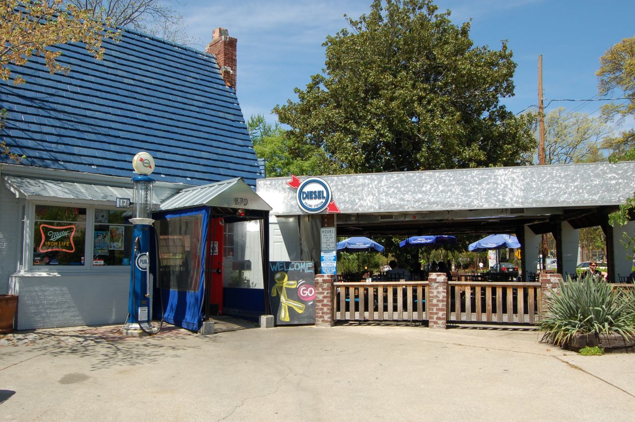 Located in the Virginia Highland neighborhood of Atlanta, Diesel Filling Station is a restaurant and bar that was repurposed from an old Pure Oil filling station. The restaurant preserved the original structure and blue roof.