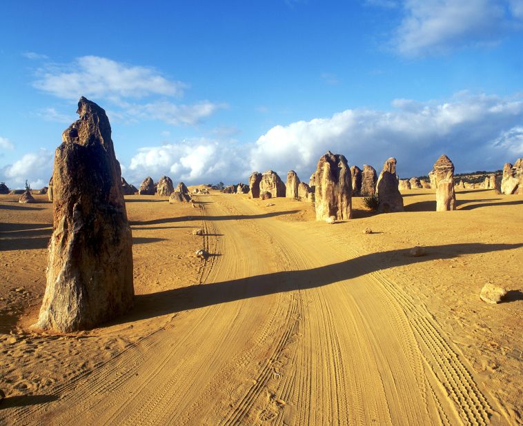 Freezing at home? Head to the Southern Hemisphere for a nice, warm getaway. Limestone formations known as the Pinnacles are located within Nambung National Park along the coast of the Indian Ocean in Western Australia. 