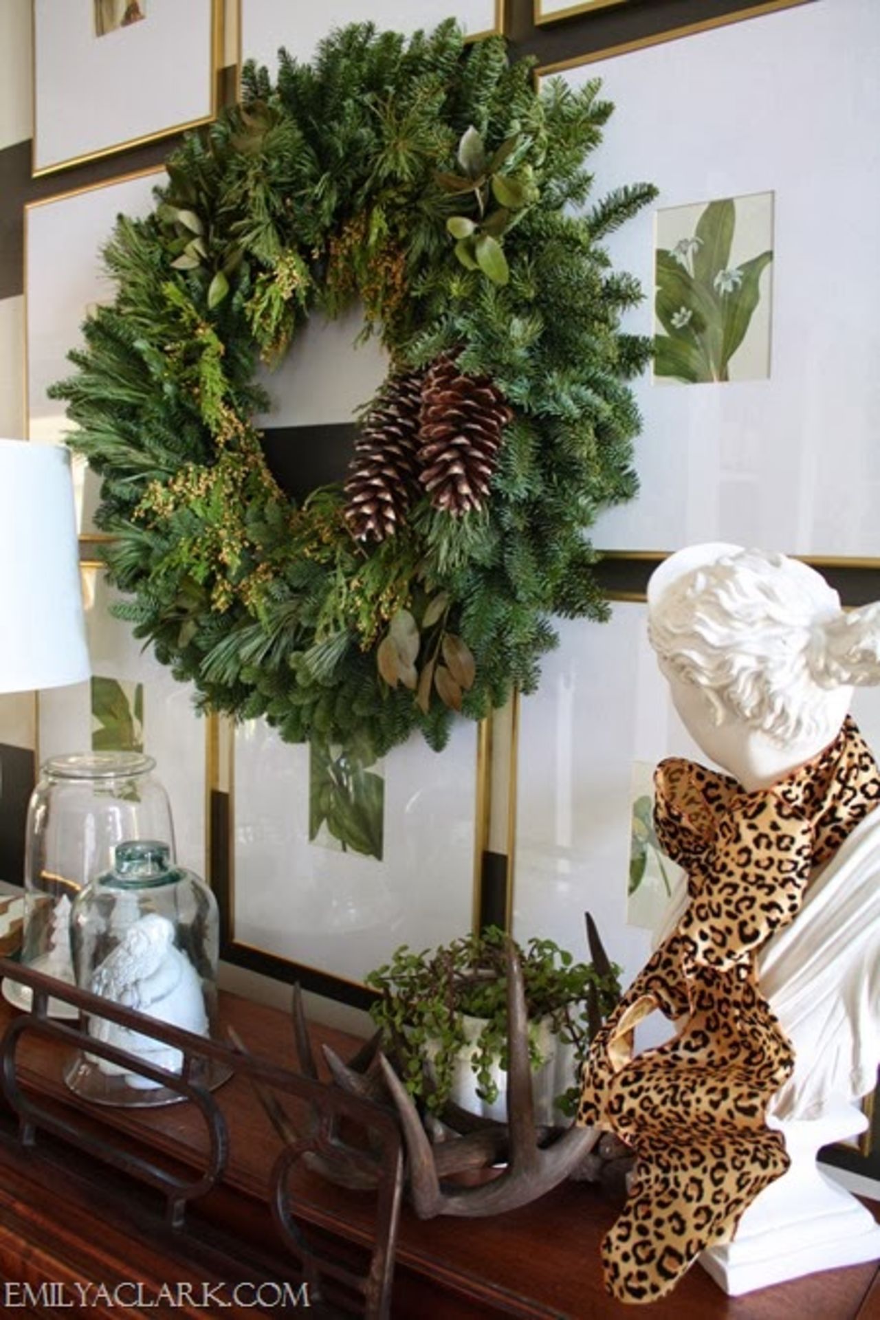 A simple wreath with pine cones and some scattered shed antlers lend a wintery air to Clark's entryway.