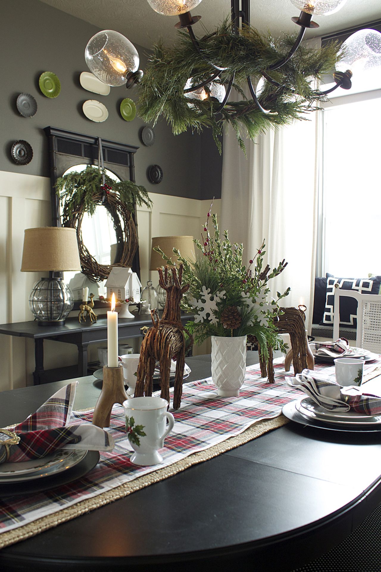 Jones' dining room includes deer figurines made of vine and a vine wreath with sprays of cut greens.