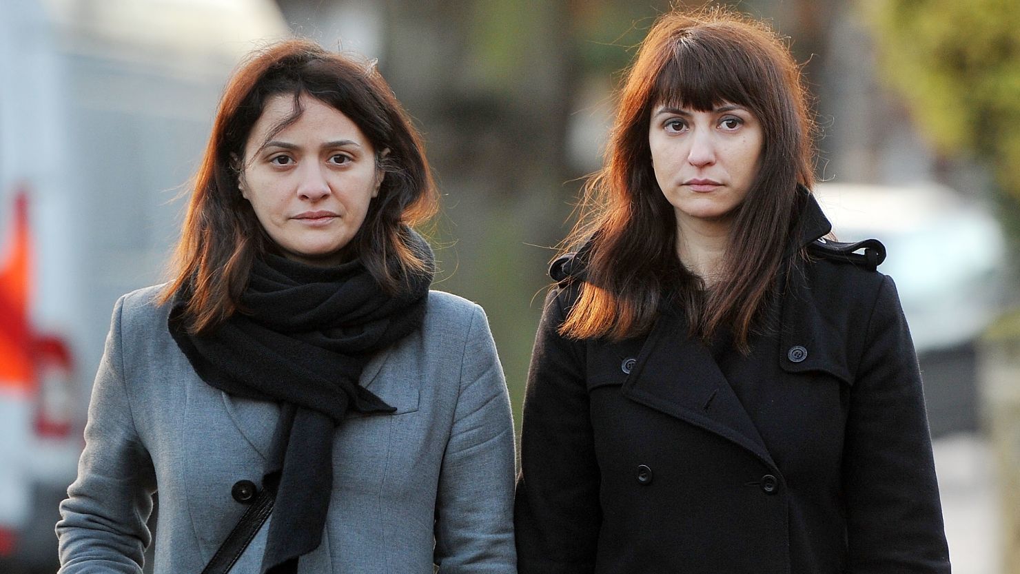  Elisabetta Grillo, left, and Francesca Grillo arrive at Isleworth Crown Court on Thursday in Isleworth, England. 