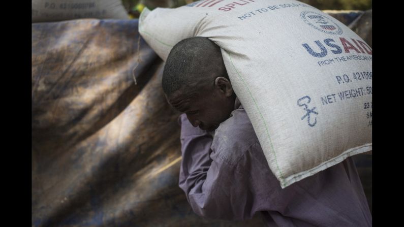 A man carries a bag of food at a Christian refugee camp in Bossangoa, Central African Republic, on December 19.
