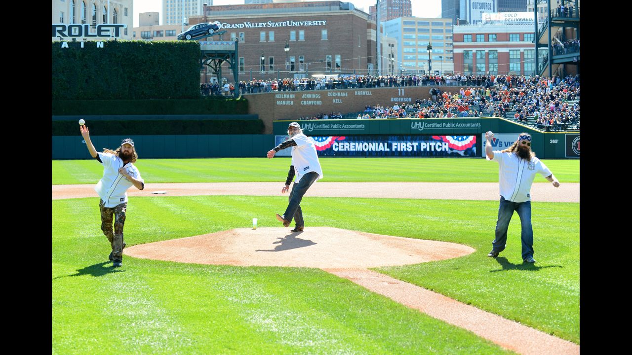 Jase, Si and Willie throw out the ceremonial first pitch before a Major League Baseball game in Detroit in September 2013.