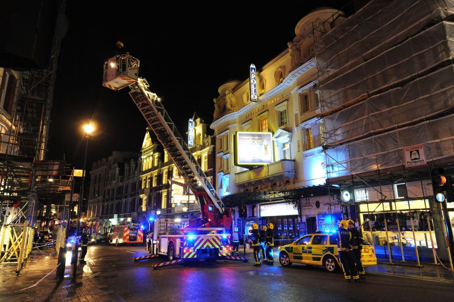 A hydraulic lift is used to investigate the cause of the collapse. "We heard a creak, somebody screamed, somebody from over there said, 'Look out!' and then the ceiling kind of creased in the middle and then just collapsed," one theatergoer said.