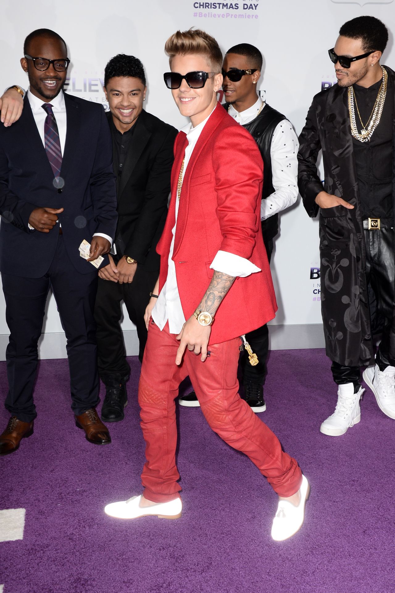 Justin Bieber has a glow as he arrives at the premiere of his new movie, "Justin Bieber's Believe," on December 18.