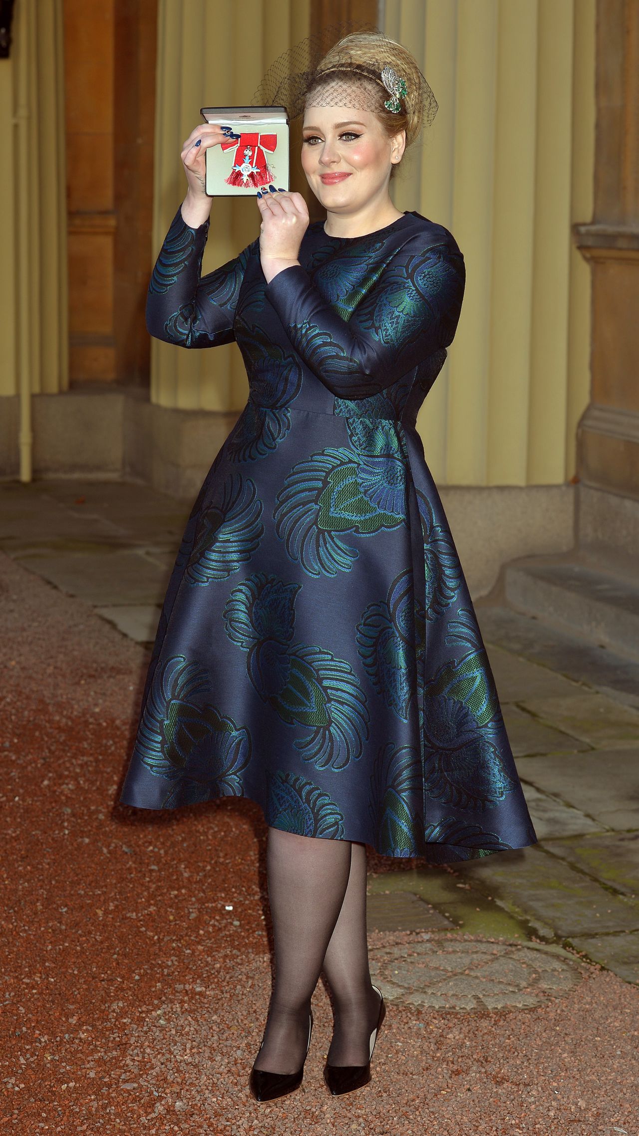 Adele receives the MBE Award for services to music on December 19.