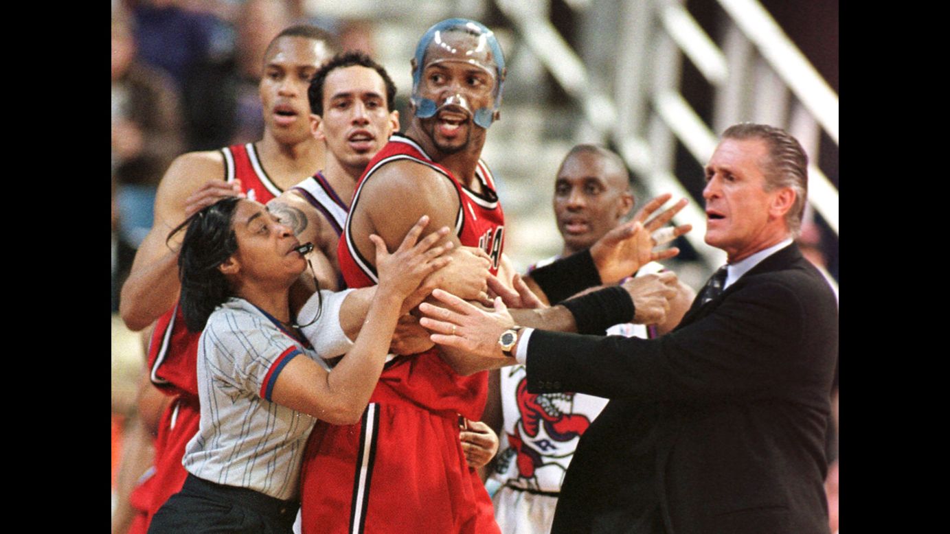 Palmer ejects Miami Heat player Alonzo Mourning, center, from a game against the Toronto Raptors as his coach, Pat Riley, tries to calm him down in April 1998. 