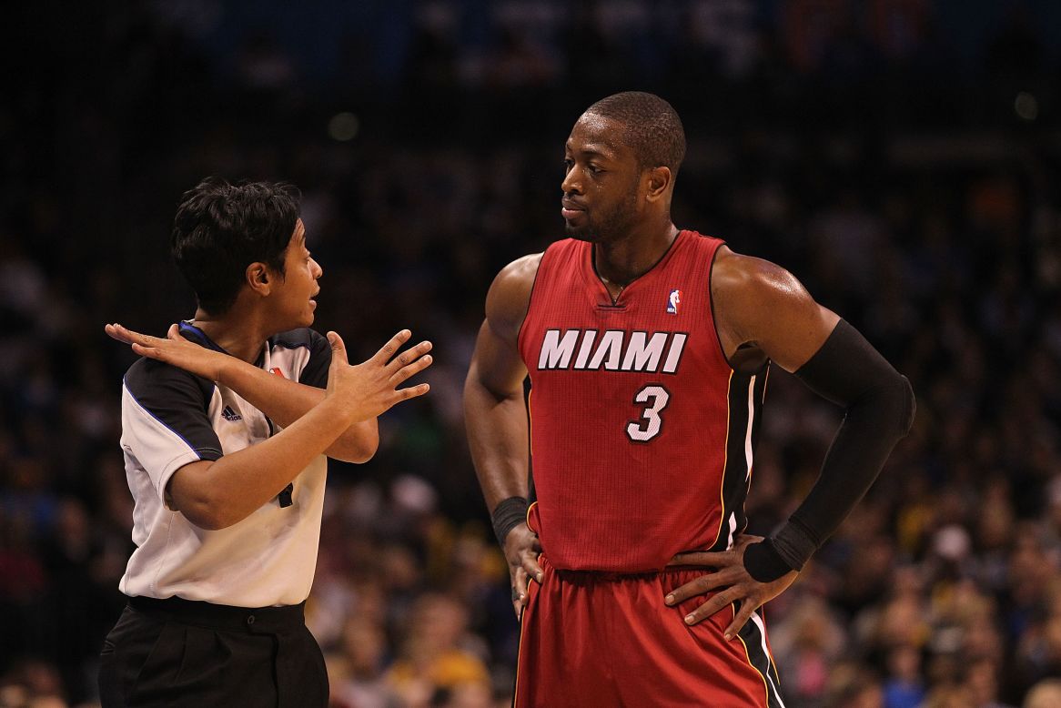 Palmer in action with Dwyane Wade of the Miami Heat in Oklahoma City in January 2011. She says she's optimistic about more women joining her ranks. "The bar is really high, but I can honestly say we have two women right now that are in our training program, and they are awesome."<br />