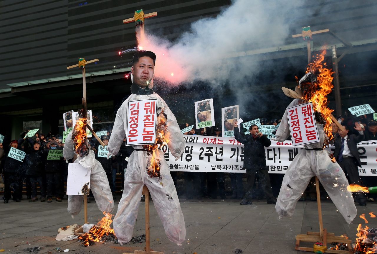 Conservative protesters in Seoul, South Korea, burn effigies of North Korean leader Kim Jong Un and former North Korean leaders Kim Jong Il and Kim Il Sung during a rally Tuesday, December 17. In response to protests in Seoul, North Korea sent a fax to South Korea threatening to "strike mercilessly without notice" for what it called "provocation against our highest dignity."