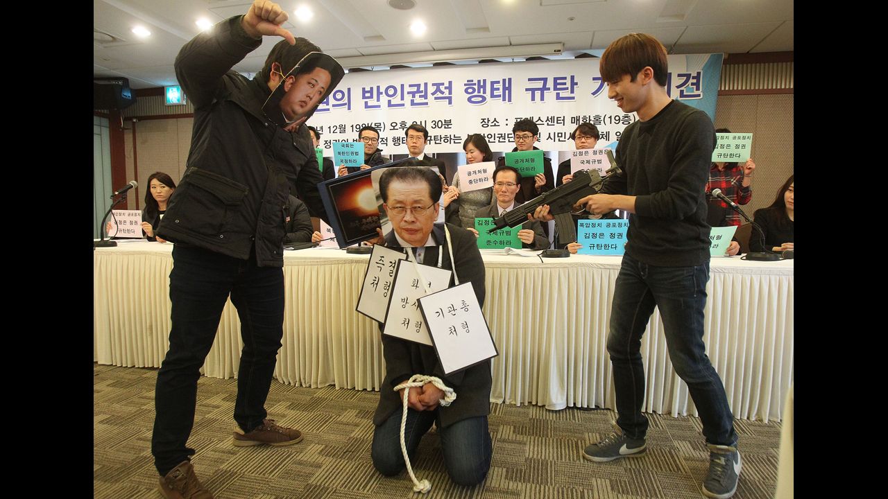 College students wear masks of Kim, left, and Kim's uncle Jang Song Thaek, center, as they perform during a news conference in Seoul denouncing Kim and alleged human rights violations on Thursday, December 19. <a href="http://edition.cnn.com/2013/12/13/world/asia/north-korea-uncle-executed/index.html">Jang's execution</a> earlier this month has unsettled North Korea's neighbors, prompting speculation about instability in the country's leadership.