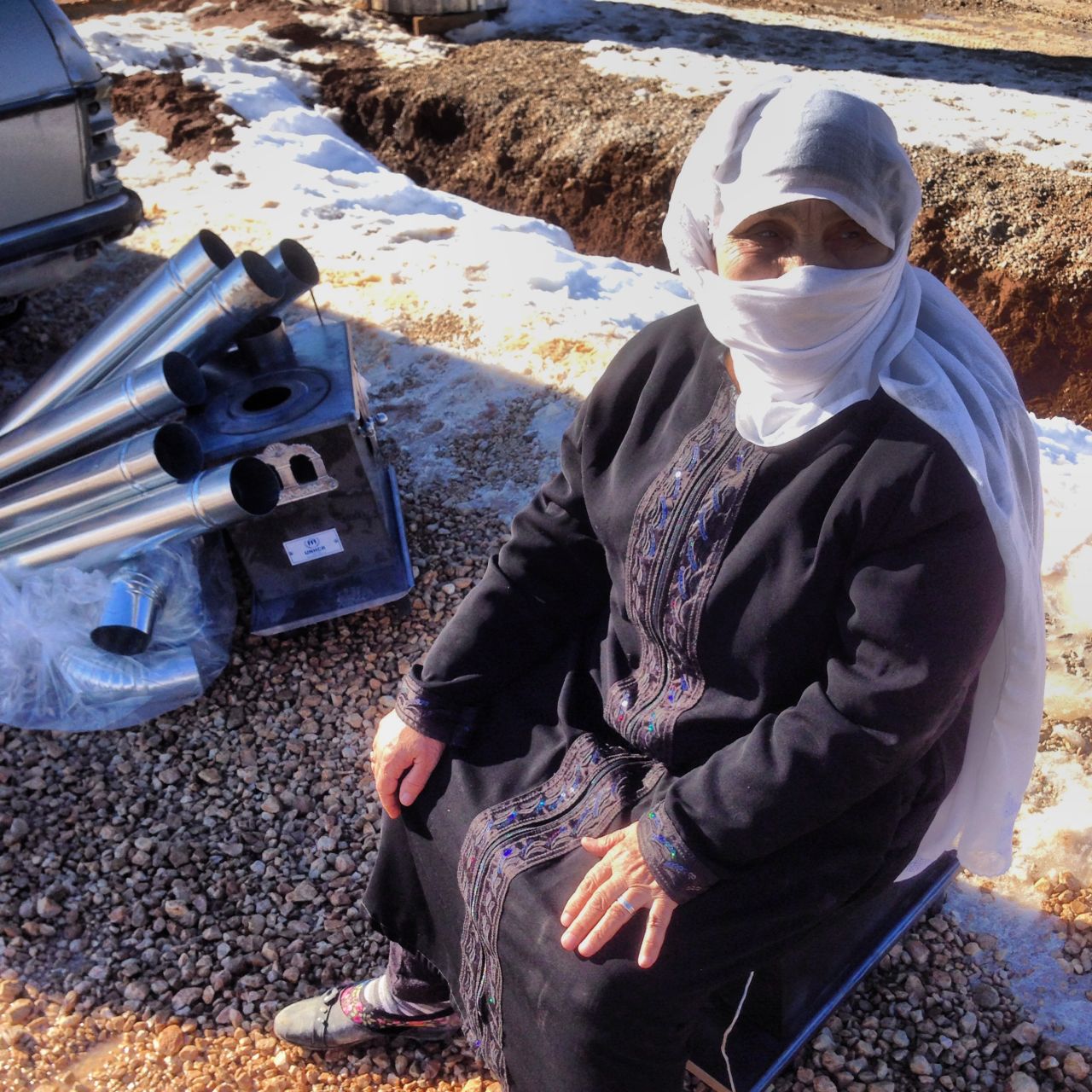 Um Bassam, a 70 year old refugee from Syria, is one of the recipients of a stove for heating that was distributed by the UNHCR in Arsal, Lebanon.