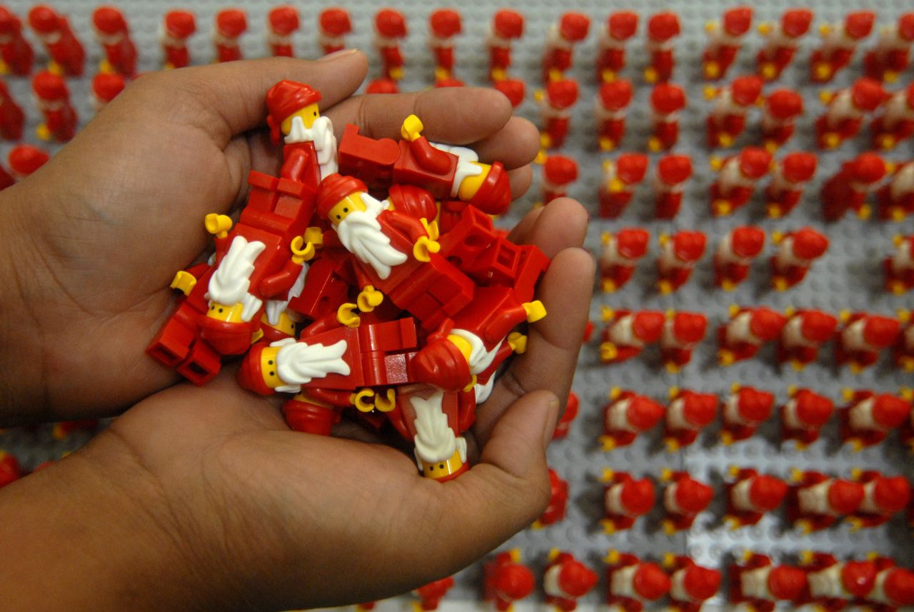 Women organize thousands of Lego Santa Clauses on Wednesday, December 18, in Surabaya, Indonesia.