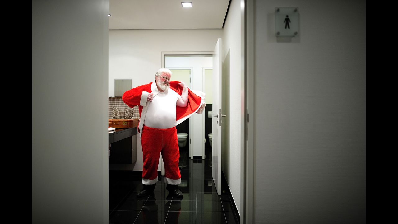 Axel Richter prepares himself for the role of Santa Claus on Thursday, December 19, in Hanover, Germany. Richter starts growing his beard out in August to be sure it's long enough by Christmas when he visits nine families and brings presents to the children, reads them poems and celebrates Christmas with them.