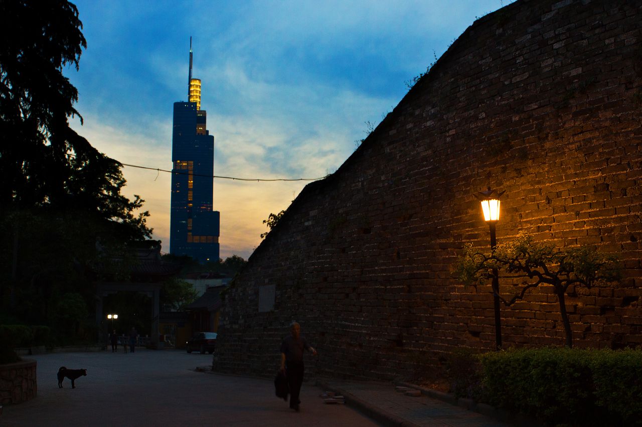 Built in the 1300s, the Ming City Wall (right) is the best preserved city wall in China. The 89-story Zifeng Tower (left) is the tallest structure in Nanjing.