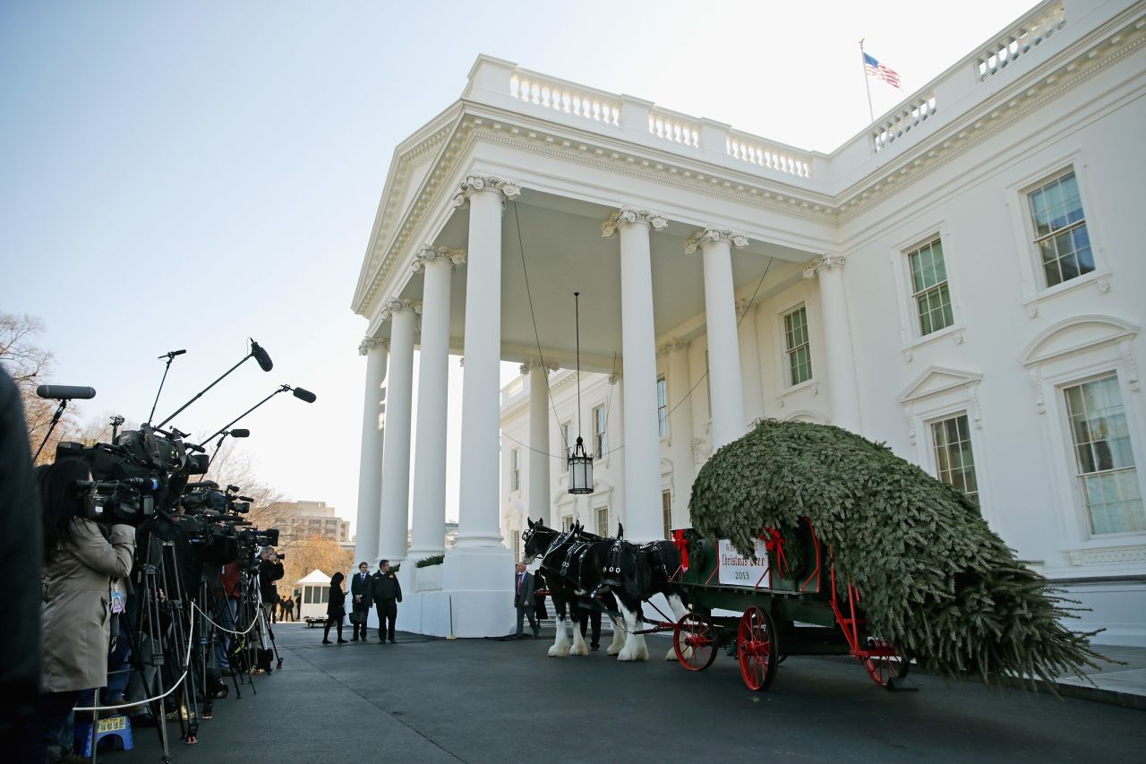 Members of the news media record the arrival of the official White House Christmas Tree at the North Portico of the White House in Washington on Friday, November 29. According to the White House, the tree, on display in the Blue Room, is an 18.5-foot Douglas fir grown by Chris Botek, a second-generation Christmas tree farmer from Lehighton, Pennsylvania.