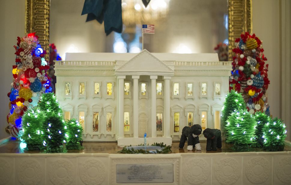 A 300-pound gingerbread White House stands among the decorations in the State Dining Room on December 4.