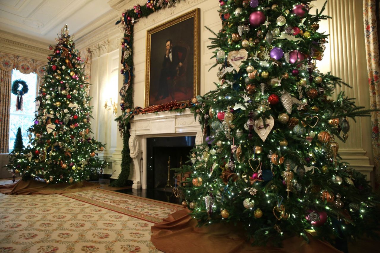 Holiday decorations are displayed in the State Dining Room.