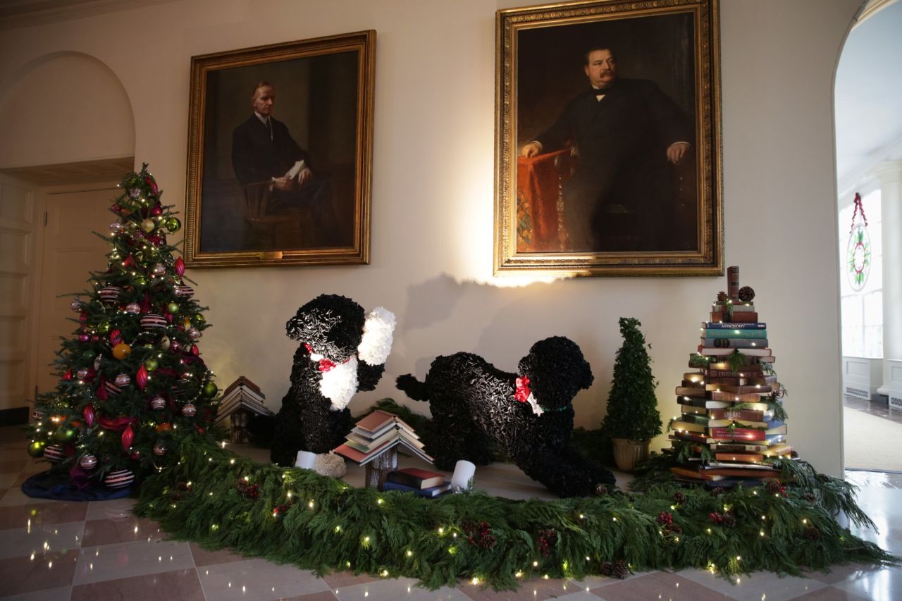 Replicas of the first dogs, Bo, left, and Sunny, right, are featured in the holiday decorations in the East Garden Room of the White House on December 4.