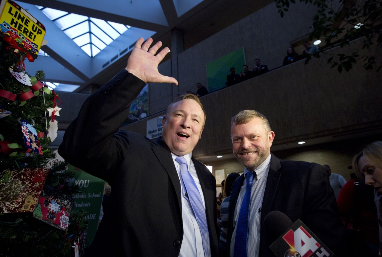Utah state Sen. Jim Dabakis, left, and Stephen Justesen acknowledge the crowd after being married in Salt Lake City in December 20, 2013.