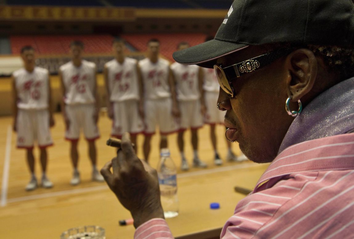 Rodman holds a cigar as he speaks to North Korean basketball players during the practice session in December 2013.