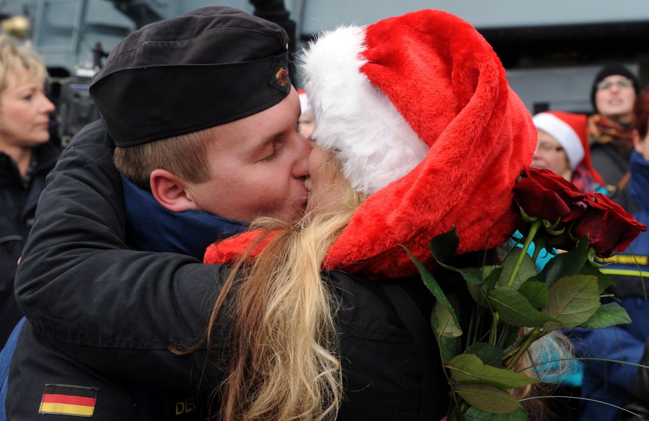 Petty Officer Second Class Sven Gruner is greeted by his girlfriend Rebecca Ankem at the Frigate Niedersachsen, docked after returning to Wilhelmshaven, Germany, on Friday, December 20, from a five-month anti-pirate operation off the Horn of Africa.