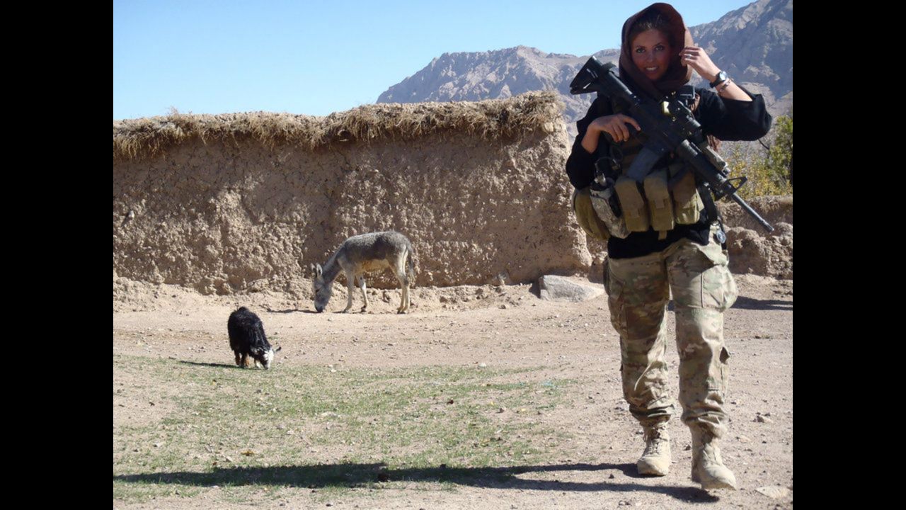 U.S. Army 1st Lt. Rachel Washburn walks through a village while serving one of two military tours in Afghanistan. Washburn is a Bronze Star recipient and a former Philadelphia Eagles NFL cheerleader from 2007 to 2009. Washburn, who was raised in a military family, is a graduate of Drexel University in Philadelphia.