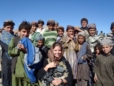 Washburn, center, worked with children and other villagers during two military tours of duty in Afghanistan.