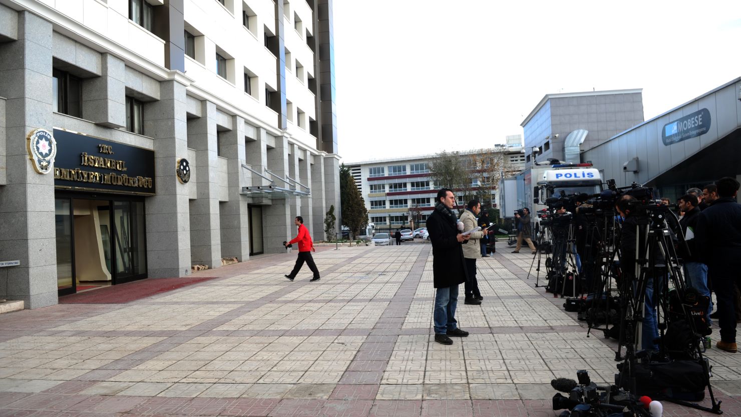 This file photo of journalists reporting outside of Istanbul Police Headquarters in Fatih, December 17. 