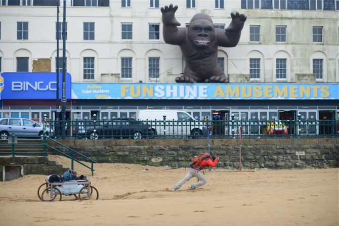 The pair prepared for their trip by dragging the cart across the wet sands of the English seaside town of Margate.