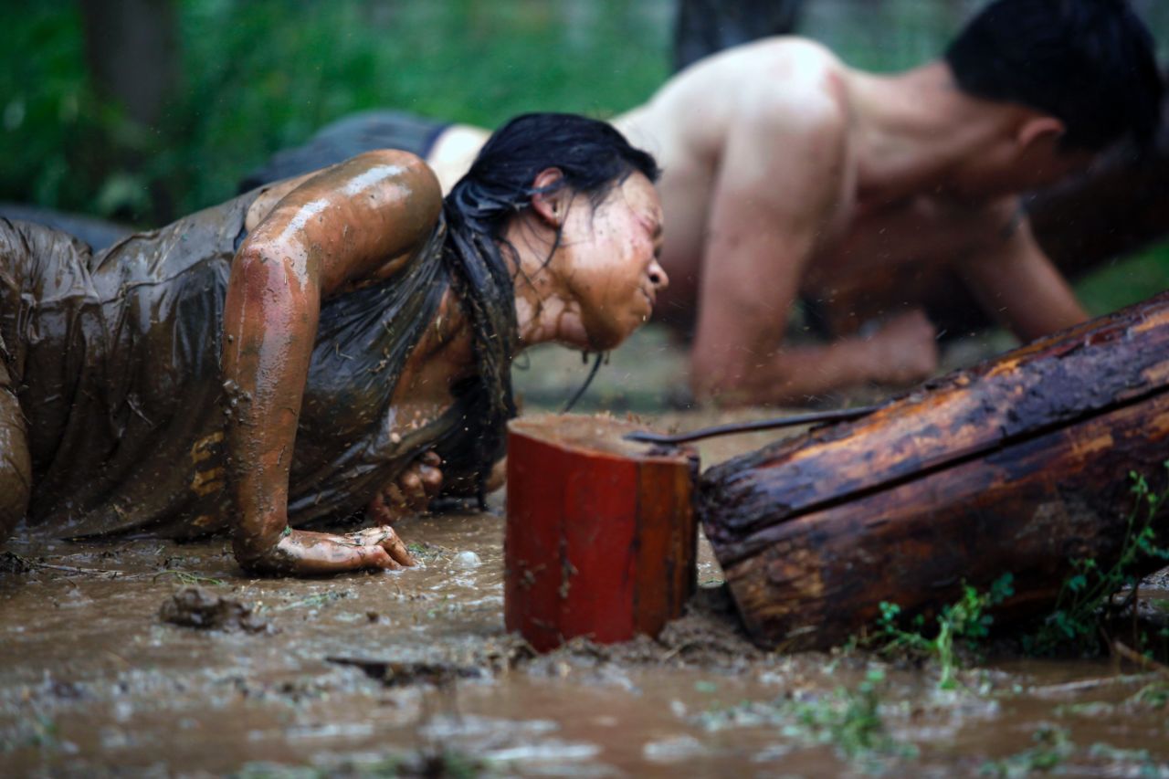 Trainees must crawl through mud and undergo other endurance training.