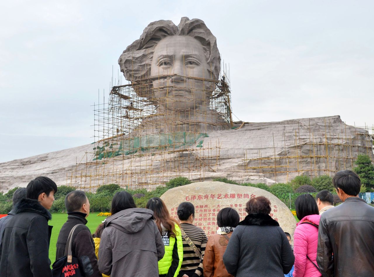 Tourists visit the statue of Mao Zedong ahead of his 120th birthday.
