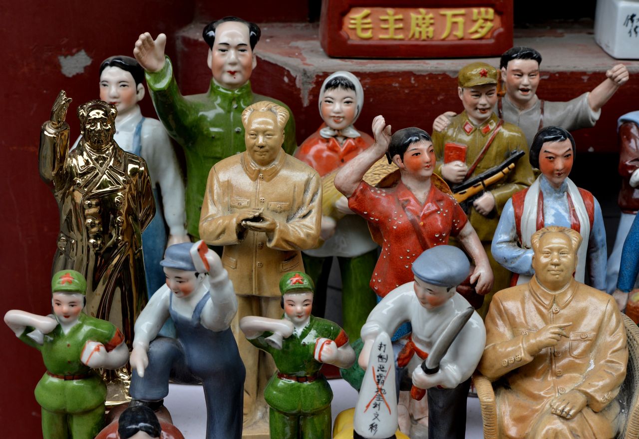 Statues of former leader Mao Zedong and figurines depicting moments in China's political history are displayed for sale at the Panjiayuan market in Beijing last year.