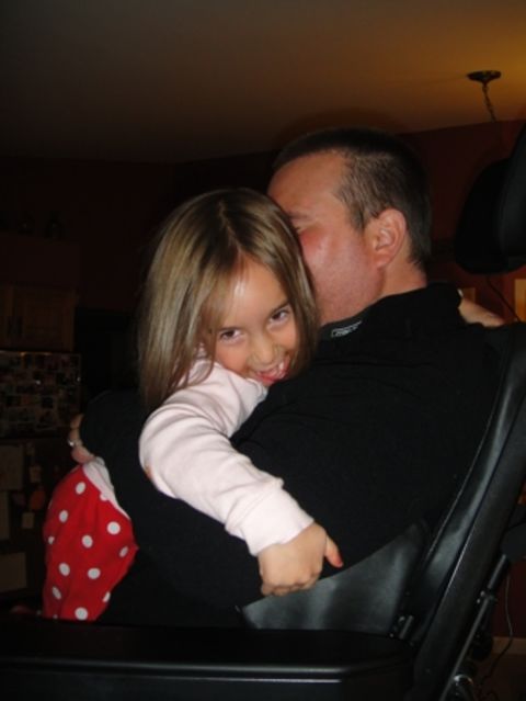 Ben and Izzy in 2011, hugging for the first time in five years. He now has a standing chair and is able to move his left arm enough to put it around her and squeeze. "The joy on her face says it all. I cried while taking the photo," Hayes said.