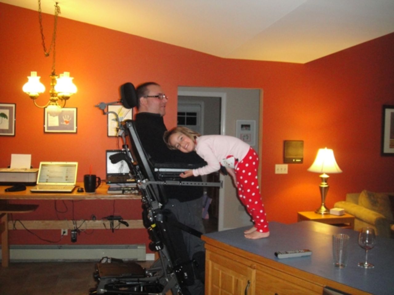 At night, Izzy crawls onto the counter so she can give her dad a kiss.